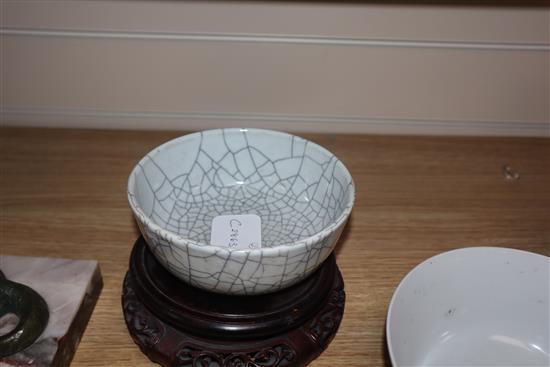 A Chinese crackle glaze bowl, early 20th century blue and white bowl and a wood stand largest diameter 17cm